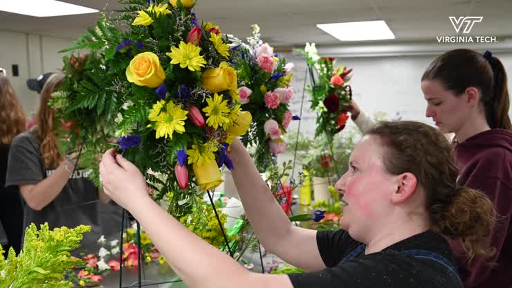 Creating floral arrangements for the April 16 Memorial