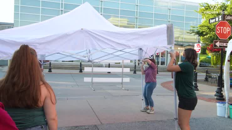Students share COVID-19 resources in downtown Blacksburg